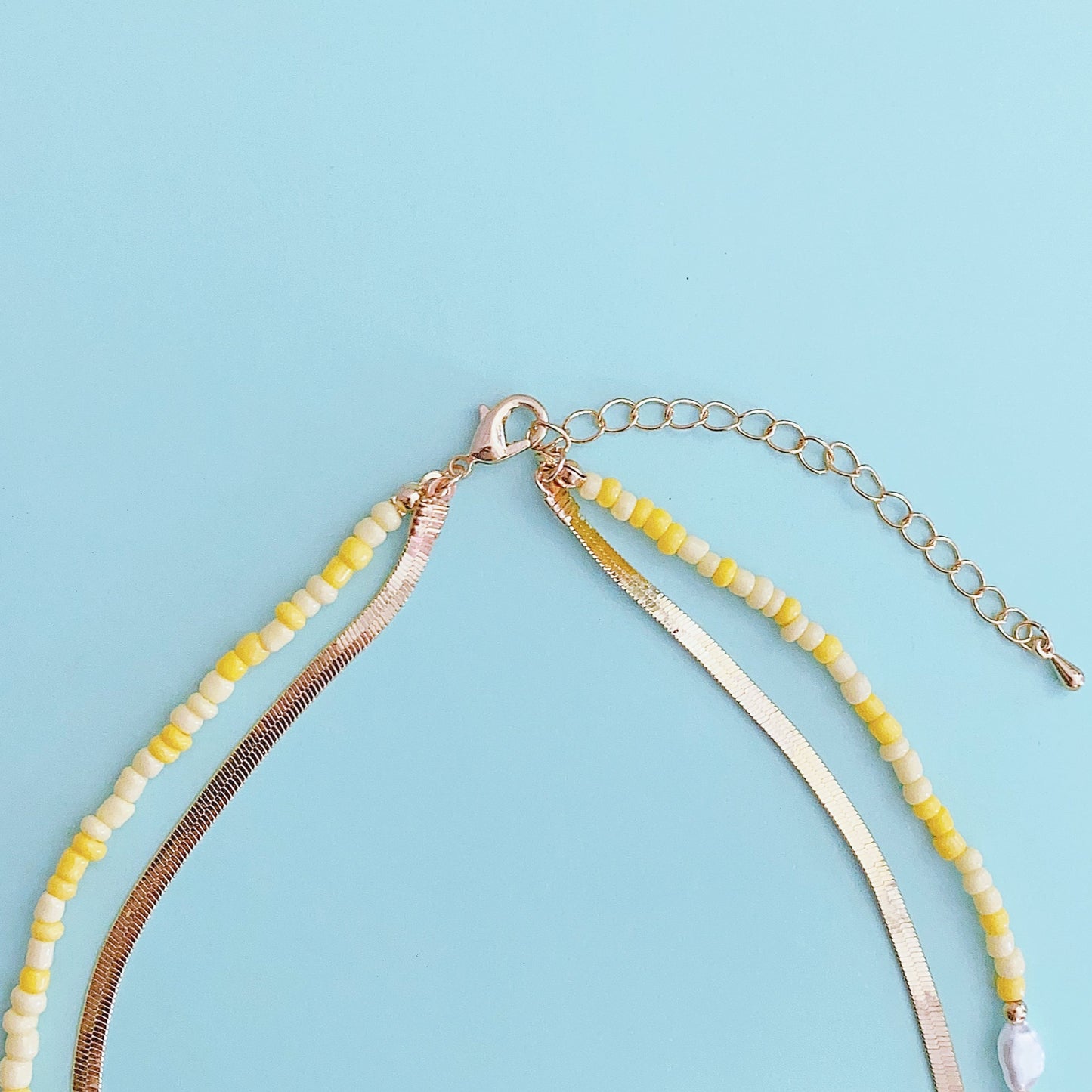 Gold-tone 2-layer beaded charm necklace