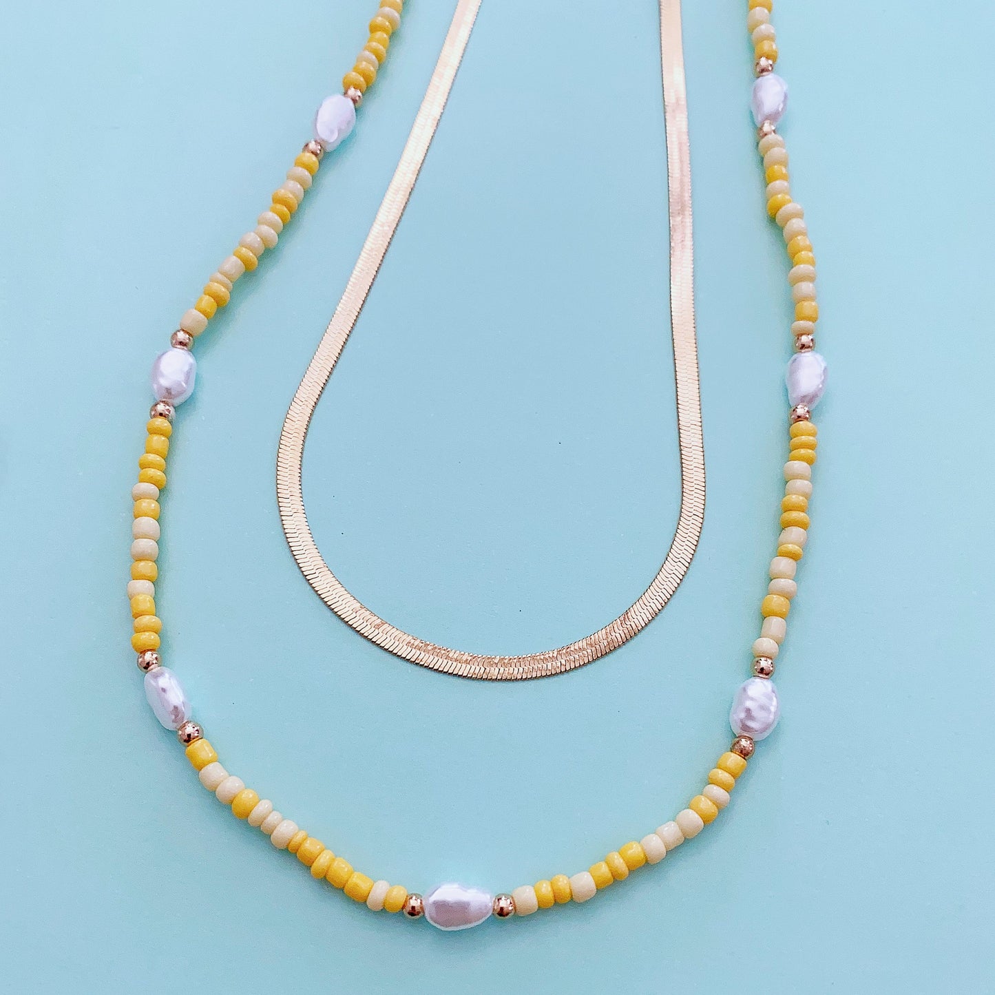 Gold-tone 2-layer beaded charm necklace