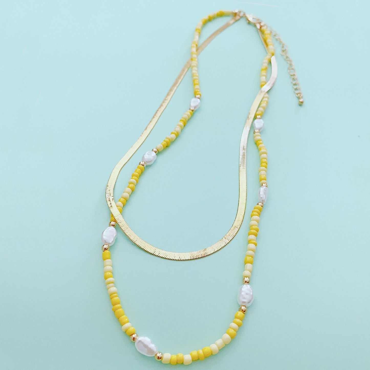 Gold-tone 2-layer beaded charm necklace